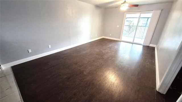 unfurnished room featuring dark hardwood / wood-style floors and ceiling fan