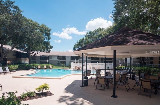 view of swimming pool featuring a gazebo and a patio area