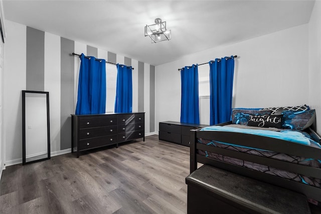 bedroom with hardwood / wood-style floors