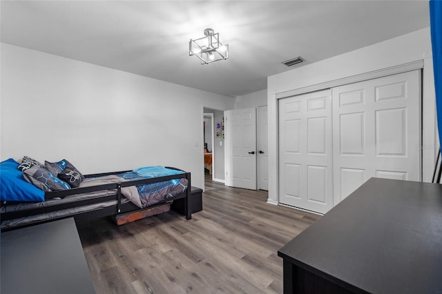 bedroom featuring a closet and hardwood / wood-style flooring