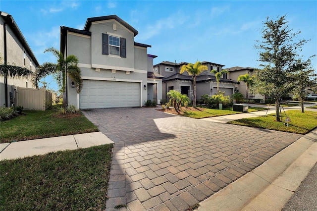 view of front property with a garage and a front yard