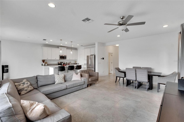 living room with ceiling fan