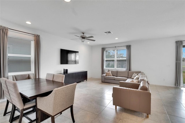 tiled dining room featuring ceiling fan