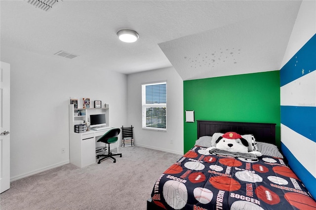 carpeted bedroom with a textured ceiling