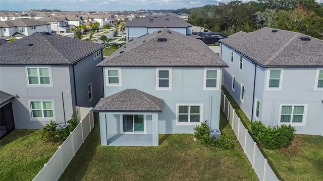 rear view of property with a patio area and a lawn