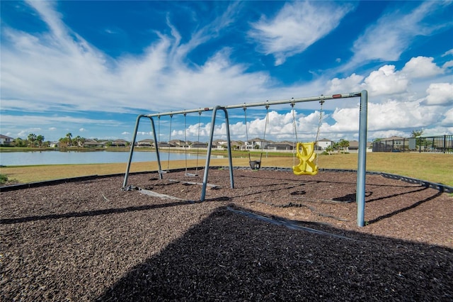 view of playground with a water view