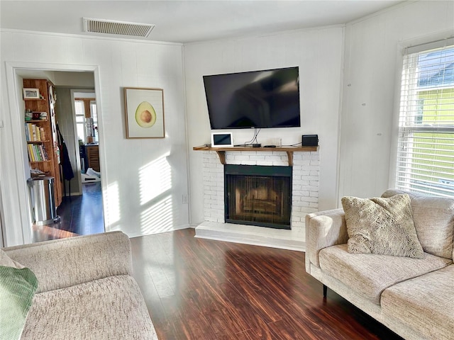 living room with a fireplace and hardwood / wood-style flooring