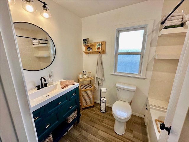 bathroom with hardwood / wood-style floors, vanity, and toilet