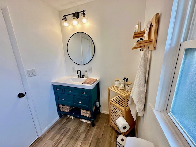 bathroom with vanity and hardwood / wood-style flooring