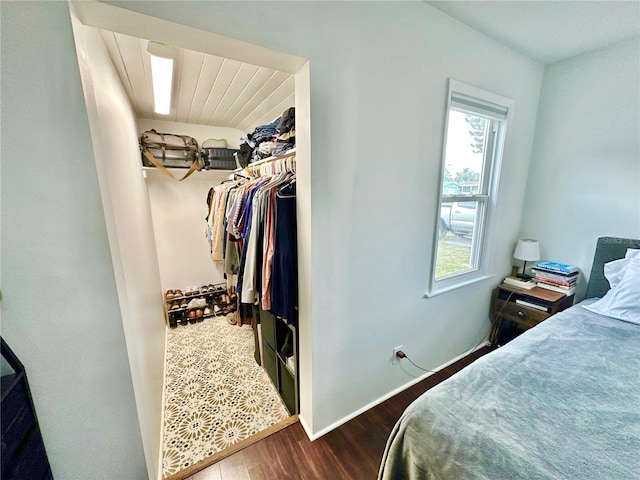 bedroom with a closet and hardwood / wood-style floors