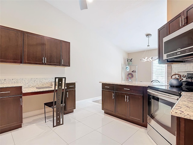 kitchen featuring pendant lighting, dark brown cabinetry, stainless steel appliances, and light tile patterned flooring