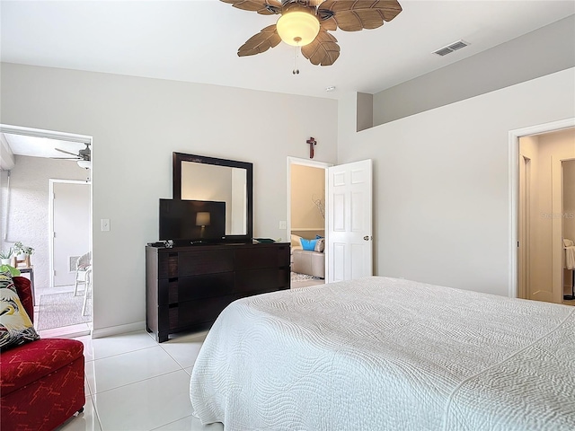 bedroom with ceiling fan and light tile patterned flooring