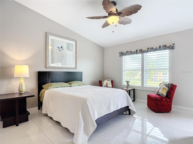 tiled bedroom with vaulted ceiling and ceiling fan