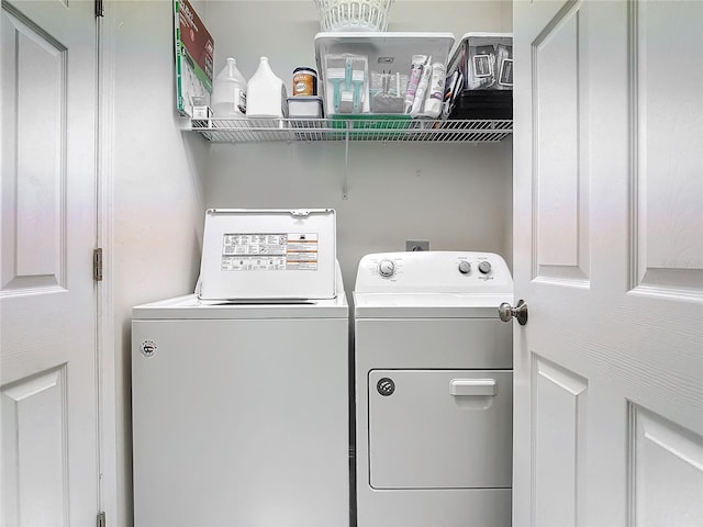 washroom with washer and clothes dryer