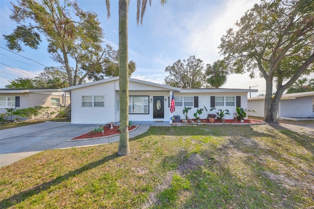 ranch-style home with a front lawn