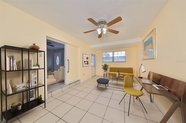 living room with ceiling fan and light tile patterned flooring