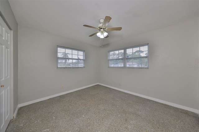 spare room with ceiling fan