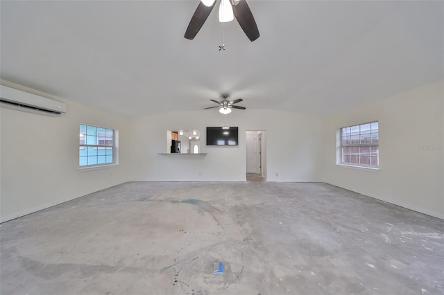 unfurnished living room featuring ceiling fan and an AC wall unit