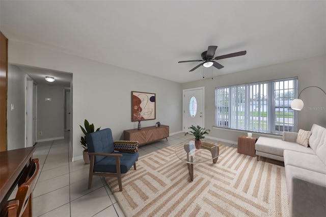 living room featuring ceiling fan and light tile patterned flooring