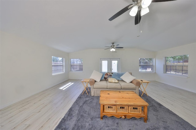 living room with wood finished floors, a healthy amount of sunlight, and ceiling fan