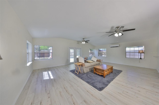 living room featuring wood finished floors, ceiling fan, a wall mounted AC, baseboards, and lofted ceiling