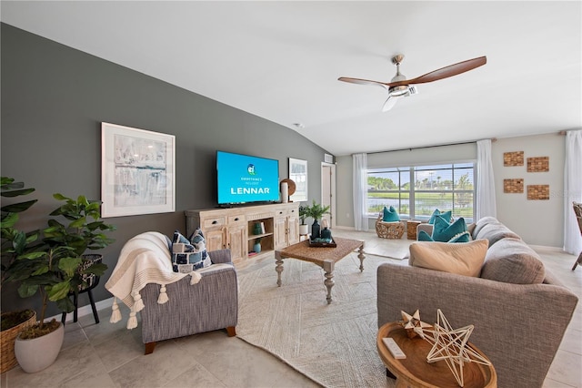 tiled living room featuring ceiling fan and lofted ceiling