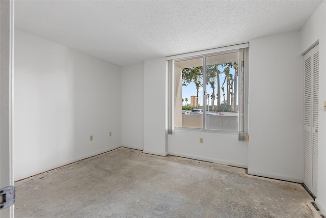 unfurnished bedroom featuring a textured ceiling