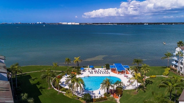 birds eye view of property with a water view