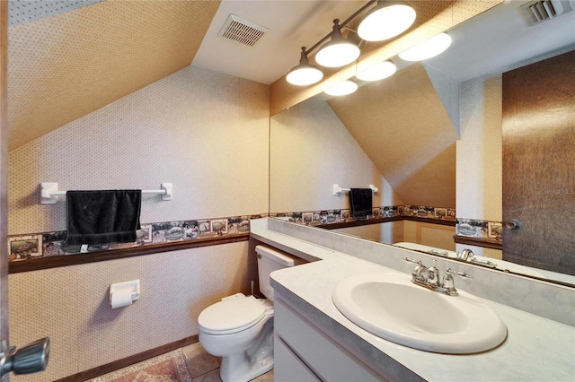 bathroom featuring tile patterned floors, vanity, and toilet