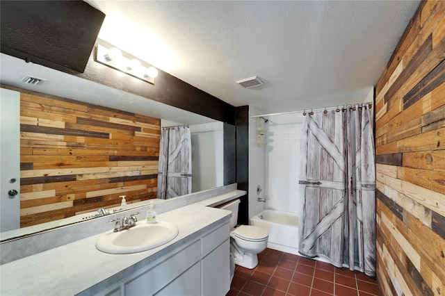 full bathroom with shower / tub combo, vanity, a textured ceiling, toilet, and wood walls