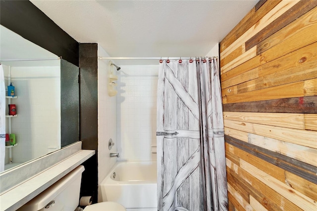 bathroom with wooden walls, shower / bathtub combination with curtain, and toilet