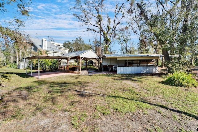 exterior space featuring a gazebo and a lawn