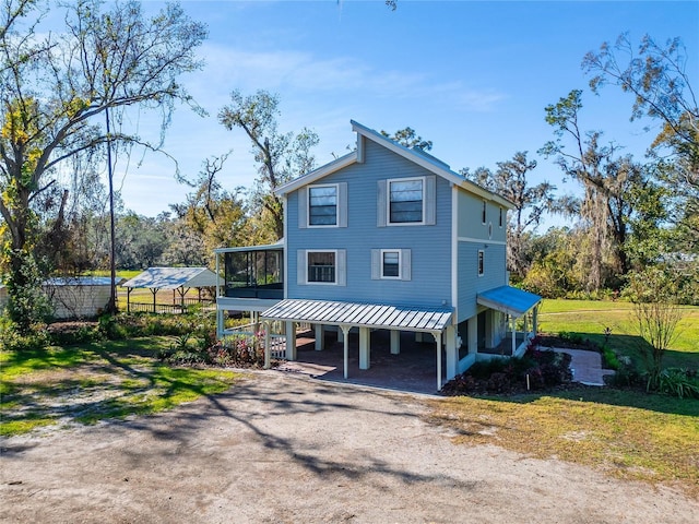 view of front of property featuring a sunroom