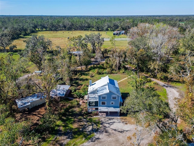 birds eye view of property with a rural view