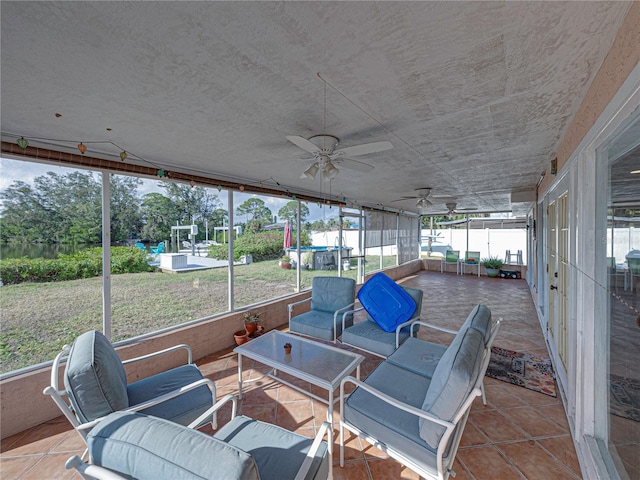 sunroom / solarium with ceiling fan