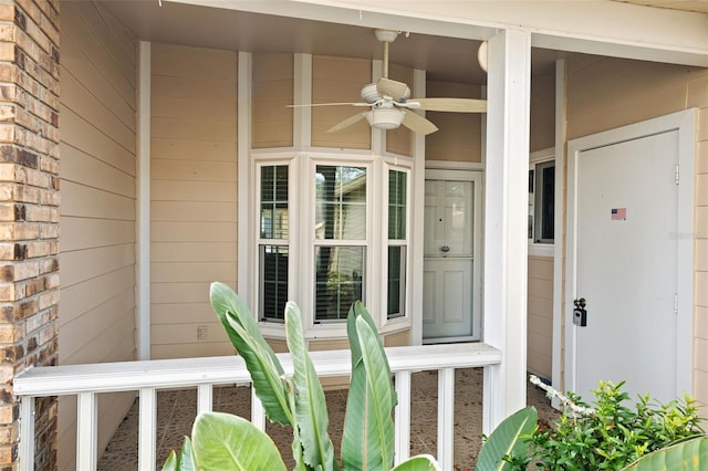 entrance to property featuring ceiling fan