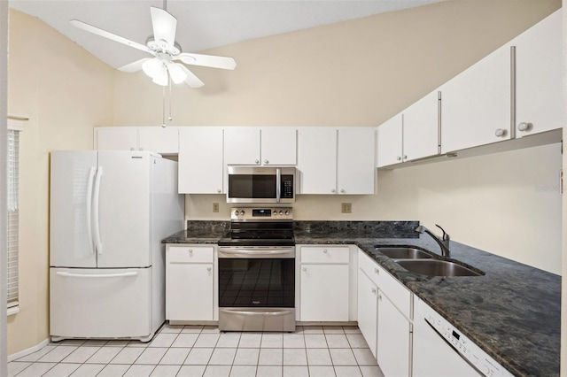 kitchen featuring white cabinets, sink, ceiling fan, light tile patterned floors, and stainless steel appliances