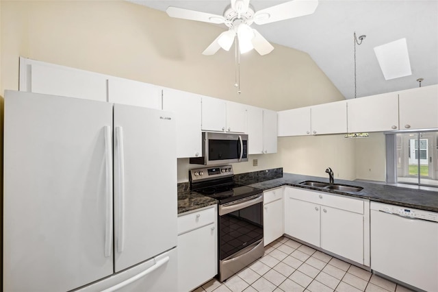 kitchen with high vaulted ceiling, white cabinets, sink, ceiling fan, and appliances with stainless steel finishes