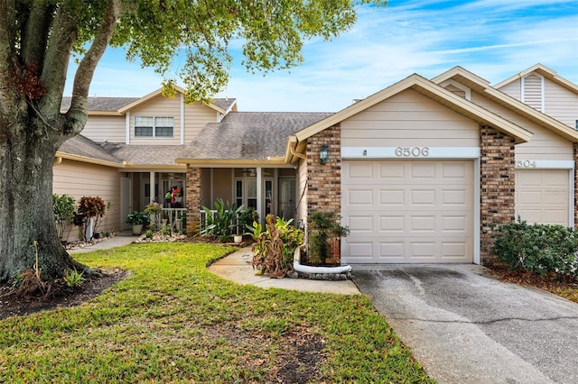 view of front facade with a garage and a front lawn