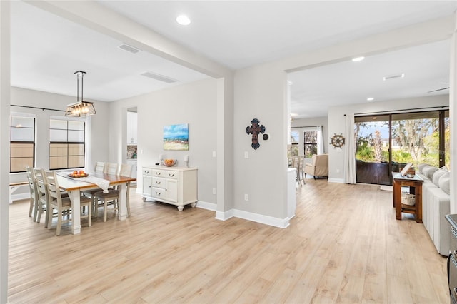 dining room with light hardwood / wood-style floors