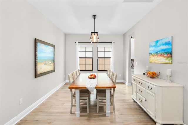 dining space featuring light hardwood / wood-style floors