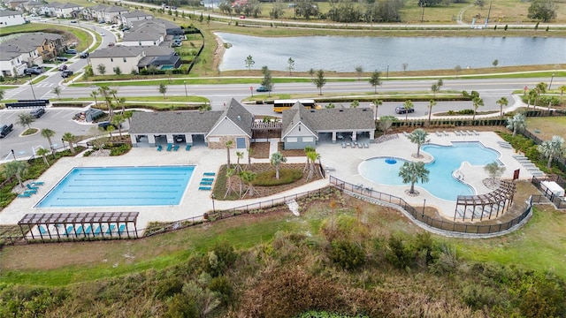 birds eye view of property featuring a water view