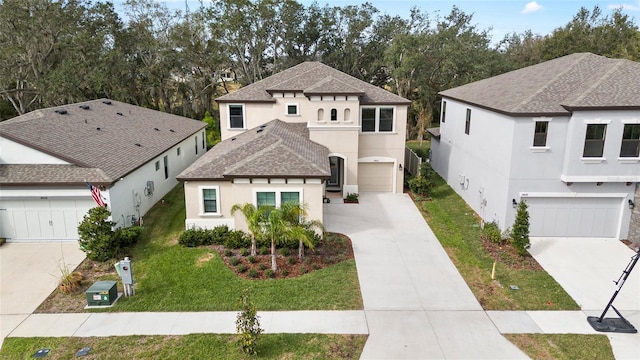 view of front of home with a garage and a front lawn