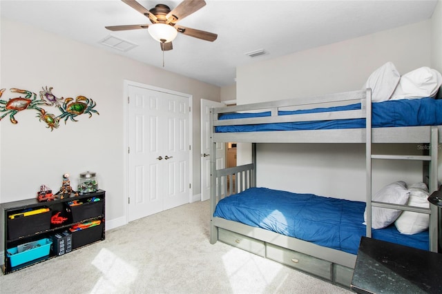 bedroom featuring ceiling fan and carpet