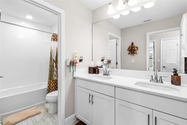 full bathroom featuring toilet, shower / bath combination with curtain, and vanity