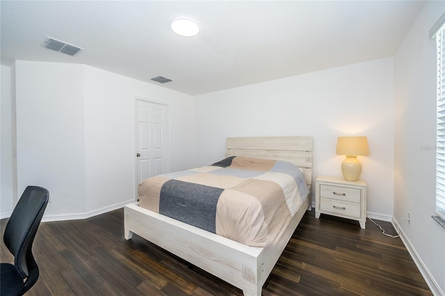 bedroom featuring dark hardwood / wood-style floors