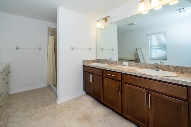 bathroom featuring a shower with shower curtain and vanity