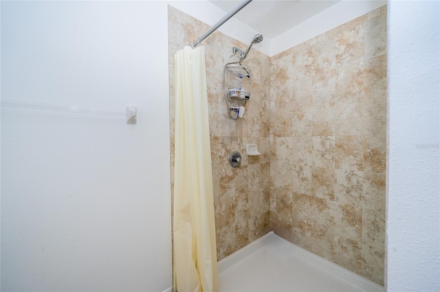 bathroom with a shower with curtain