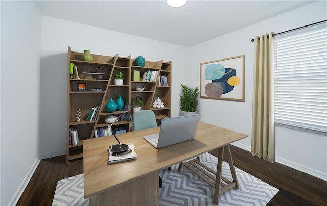 office with dark wood-type flooring