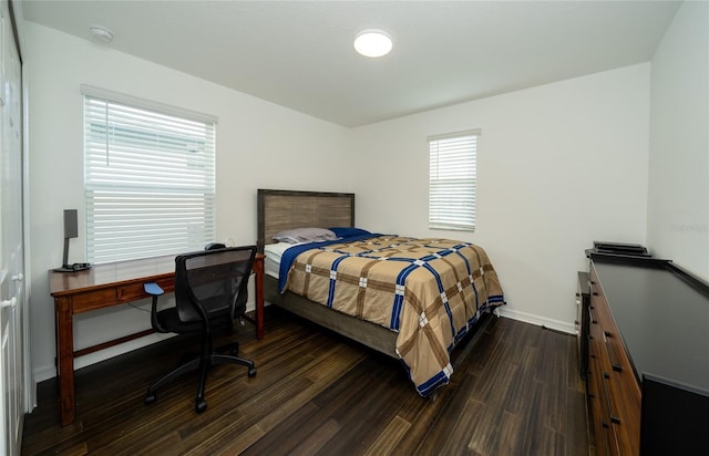 bedroom featuring dark wood-type flooring